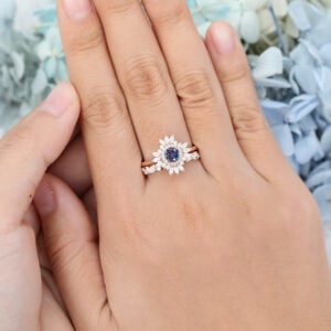 The vintage alexandrite bridal ring set features a round alexandrite engagement ring with moissanite halo design and pairing with a moissanite wedding ring, unique and brilliant.
