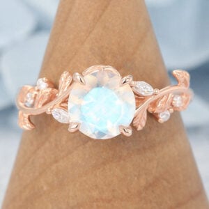 14k Rose Gold Vintage Moonstone Engagement Ring fatures a large round moonstone and nature-inspired rose gold band, which is a rose gold moonstone ring for engagement.