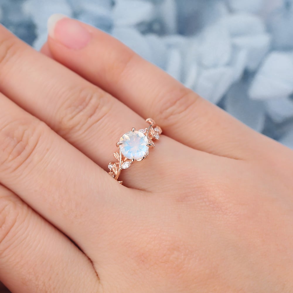 14k Rose Gold Vintage Moonstone Engagement Ring fatures a large round moonstone and nature-inspired rose gold band, which is a rose gold moonstone ring for engagement.