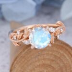 14k Rose Gold Vintage Moonstone Engagement Ring fatures a large round moonstone and nature-inspired rose gold band, which is a rose gold moonstone ring for engagement.