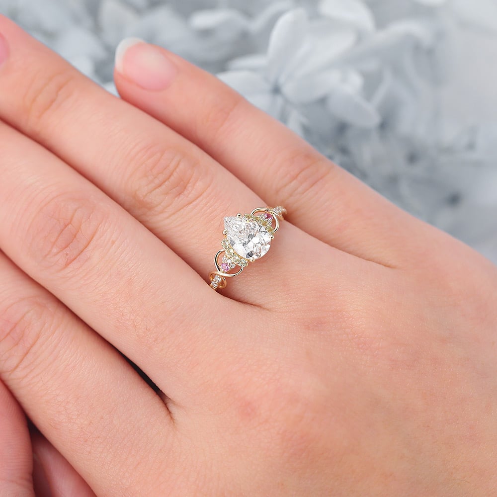 Pear Cut Lab Grown Diamond Infinity Engagement Ring with Pink Sapphire and Peridot Accents