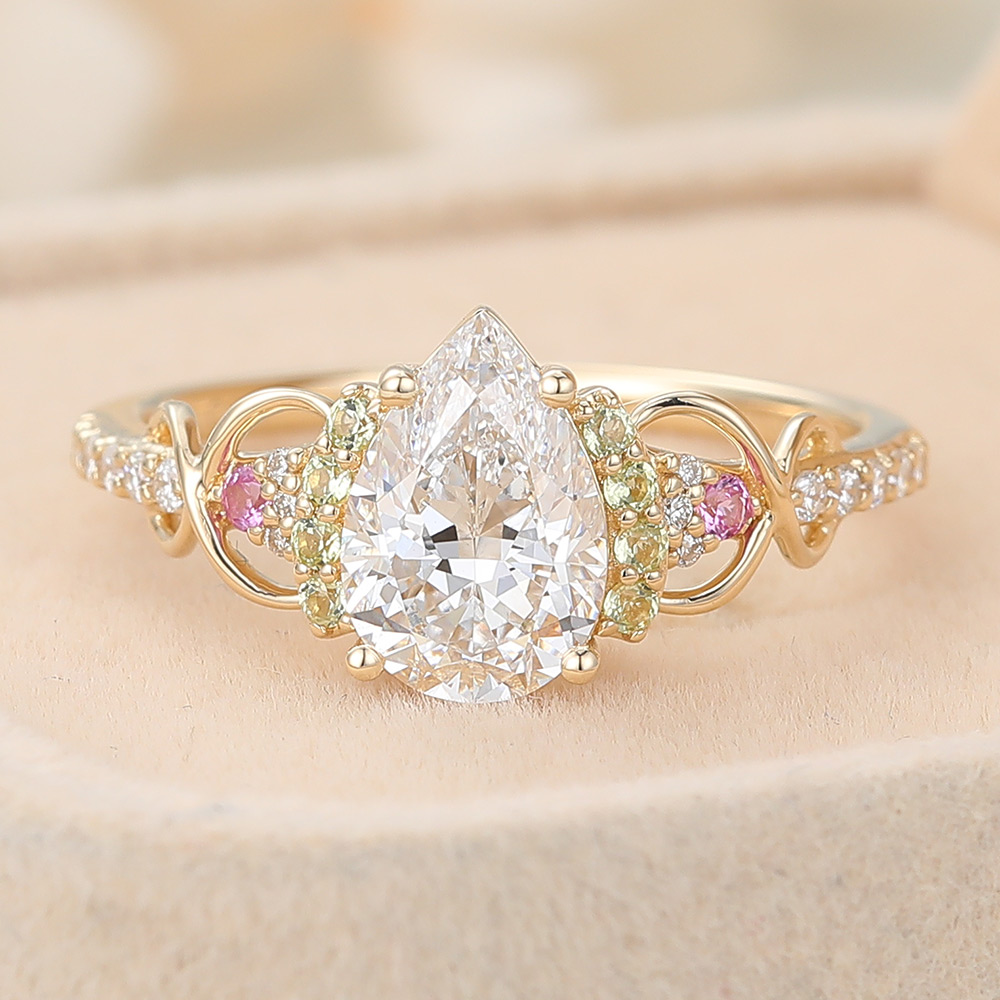 Pear Cut Lab Grown Diamond Infinity Engagement Ring with Pink Sapphire and Peridot Accents (3) Pear Cut Lab Grown Diamond Infinity Engagement Ring with Pink Sapphire and Peridot Accents (3)