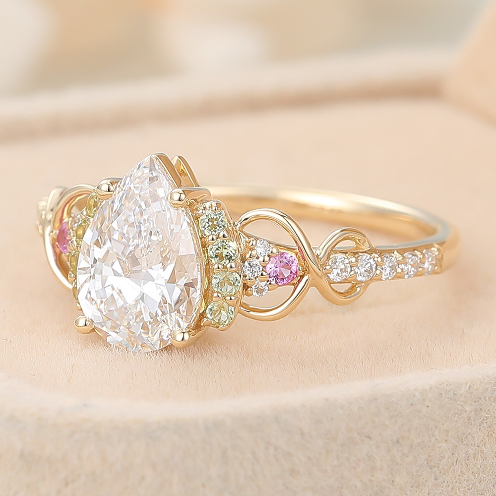 Pear Cut Lab Grown Diamond Infinity Engagement Ring with Pink Sapphire and Peridot Accents (4) Pear Cut Lab Grown Diamond Infinity Engagement Ring with Pink Sapphire and Peridot Accents (4)