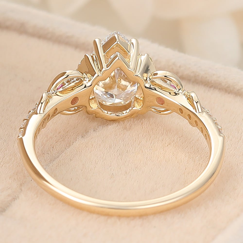 Pear Cut Lab Grown Diamond Infinity Engagement Ring with Pink Sapphire and Peridot Accents (5) Pear Cut Lab Grown Diamond Infinity Engagement Ring with Pink Sapphire and Peridot Accents (5)