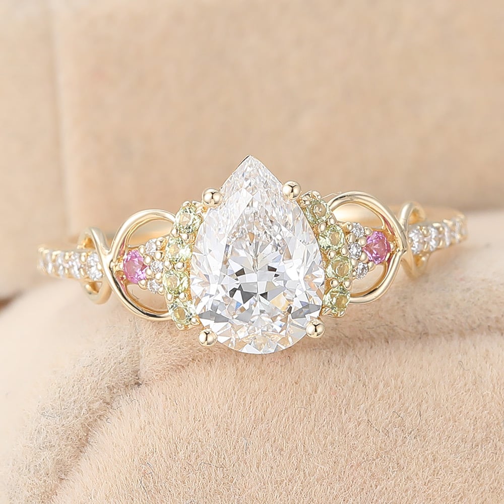 Pear Cut Lab Grown Diamond Infinity Engagement Ring with Pink Sapphire and Peridot Accents (6) Pear Cut Lab Grown Diamond Infinity Engagement Ring with Pink Sapphire and Peridot Accents (6)