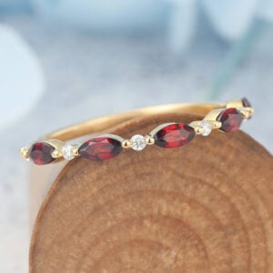 The ruby and moissanite eternity band features alternating marquise-cut rubies and round moissanite stones set on the band, making it a perfect stacking ring for women. Capricorn birthstone Leo Birthstone
