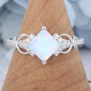 Princess Cut Opal Ring White Gold Infinity Bridal Ring features a large opal center stone and white gold band, unique and elegant.