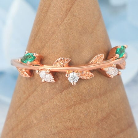 Nature-Inspired Curved Wedding Band with Emerald, Diamond & Leaf Design