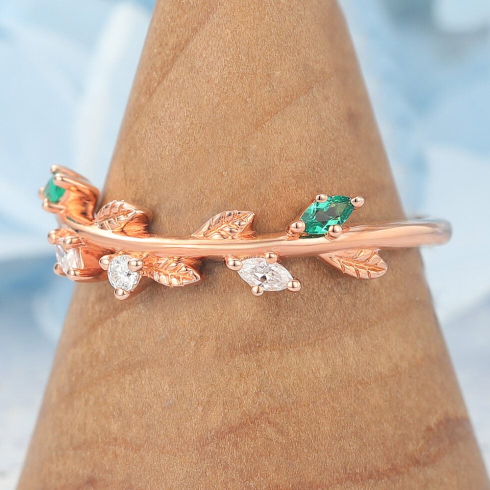 Nature-Inspired Curved Wedding Band with Emerald, Diamond & Leaf Design