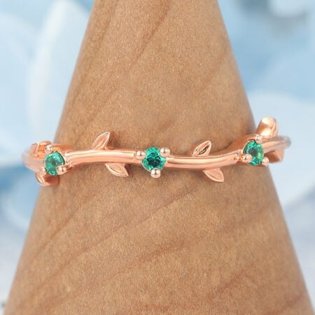 Vine-Inspired Curved Wedding Band with Emerald Accents