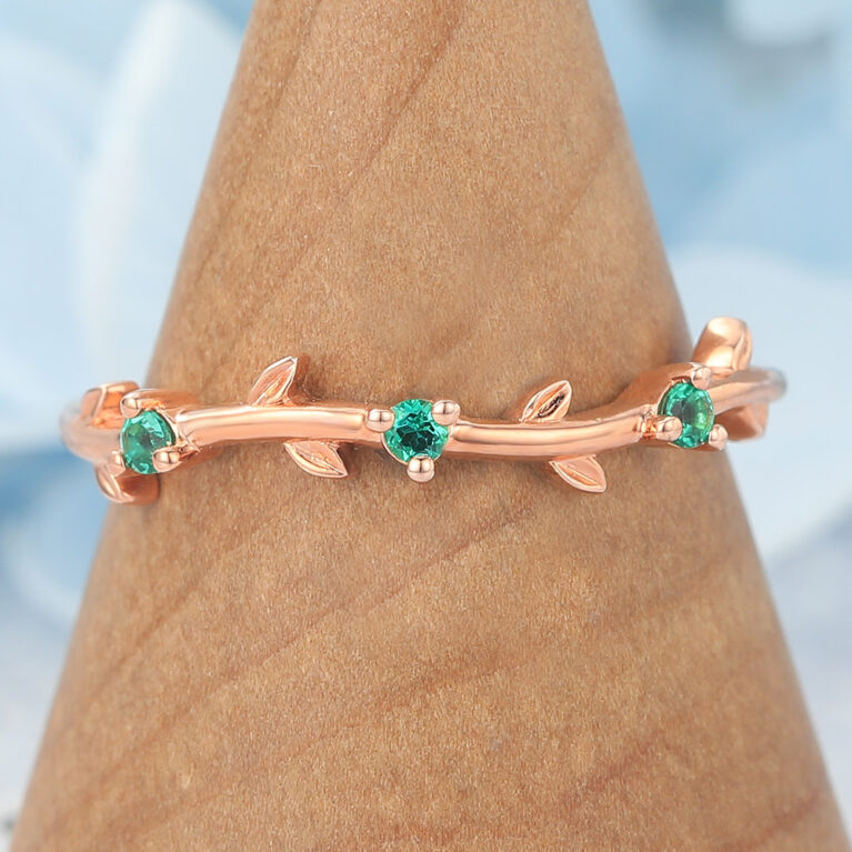 Vine-Inspired Curved Wedding Band with Emerald Accents
