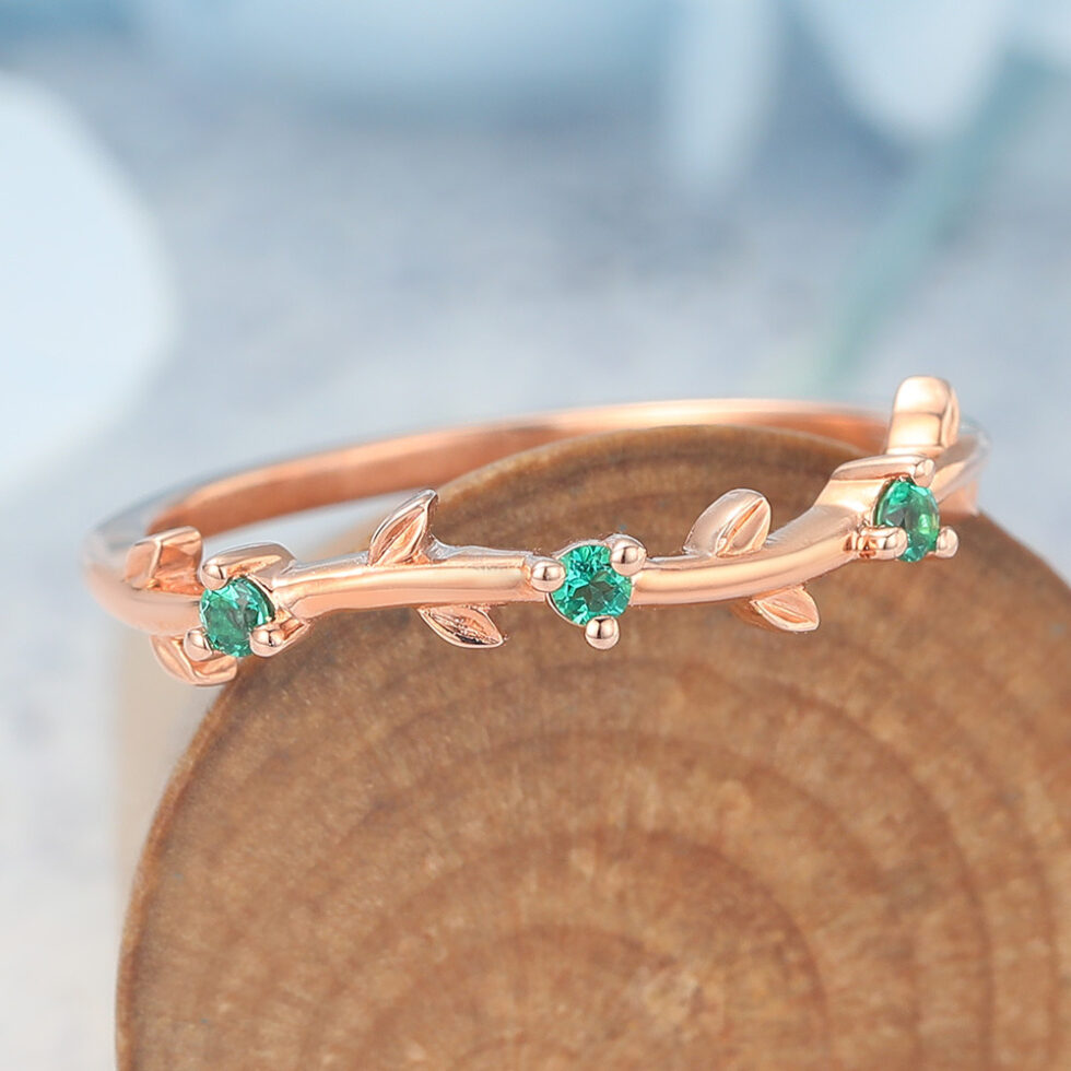 Vine-Inspired Curved Wedding Band with Emerald Accents