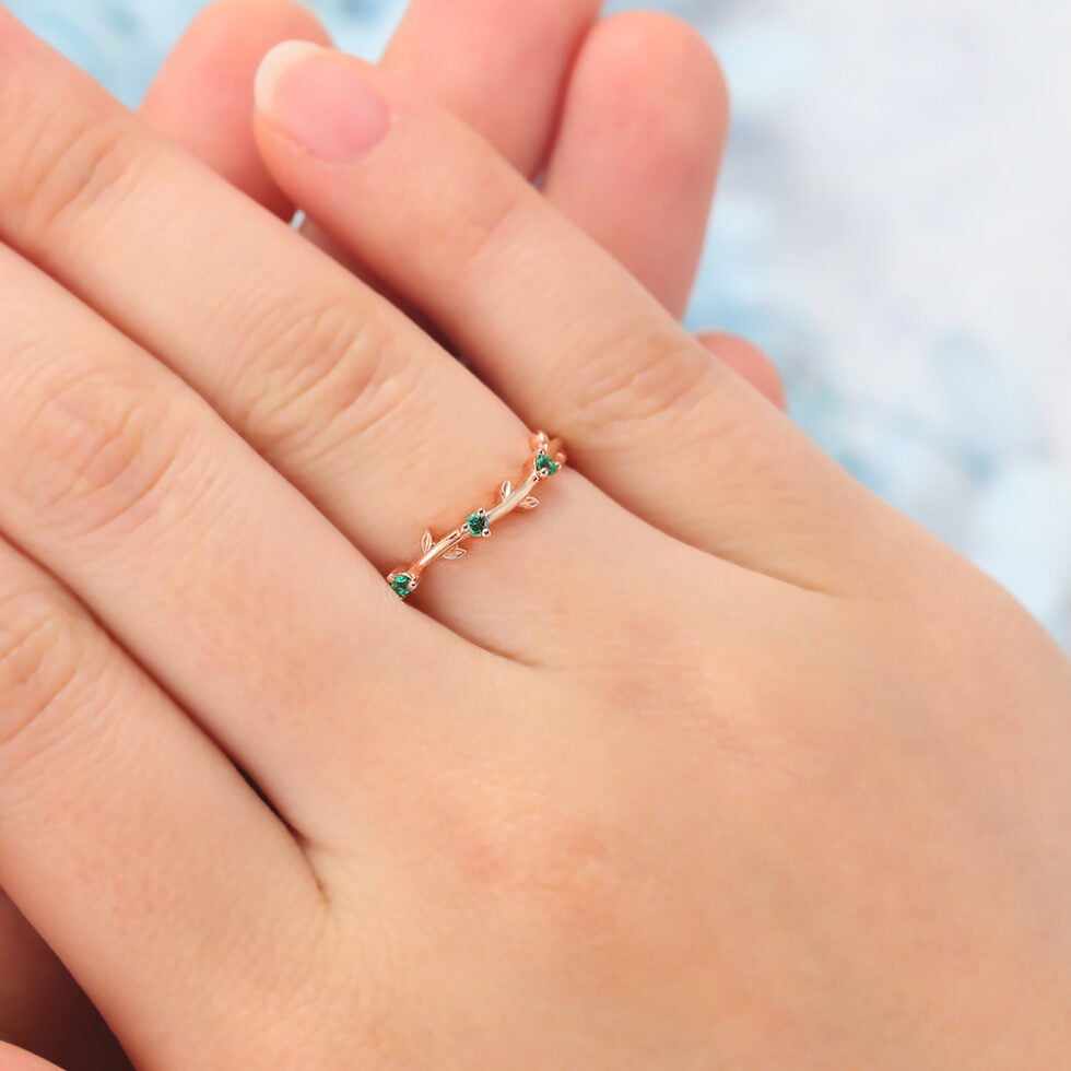 Vine-Inspired Curved Wedding Band with Emerald Accents