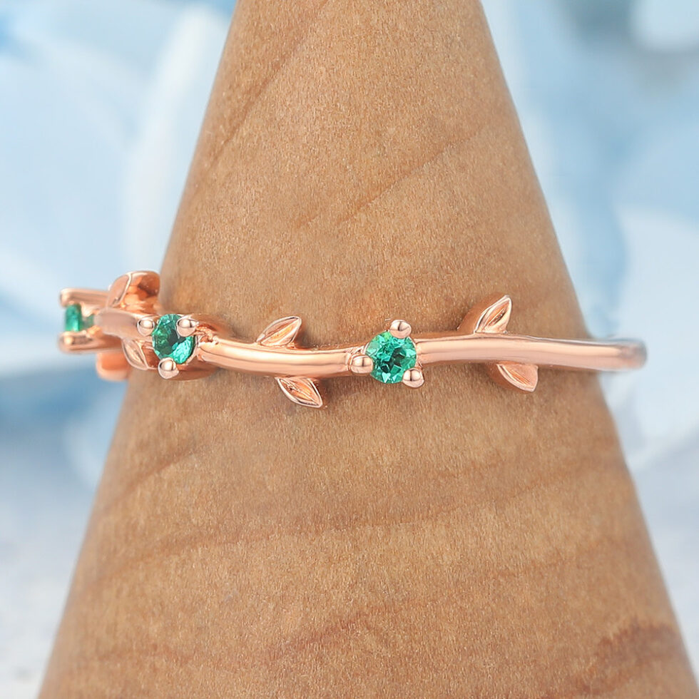Vine-Inspired Curved Wedding Band with Emerald Accents