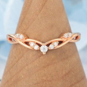 The twisted curved diamond band features small round diamond stones and curved vine design, unique and elegant.