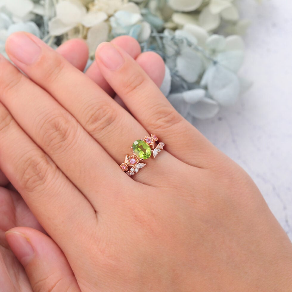 Oval Cut Peridot Nature-Inspired Bridal Ring Set with Pink Sapphire Accents