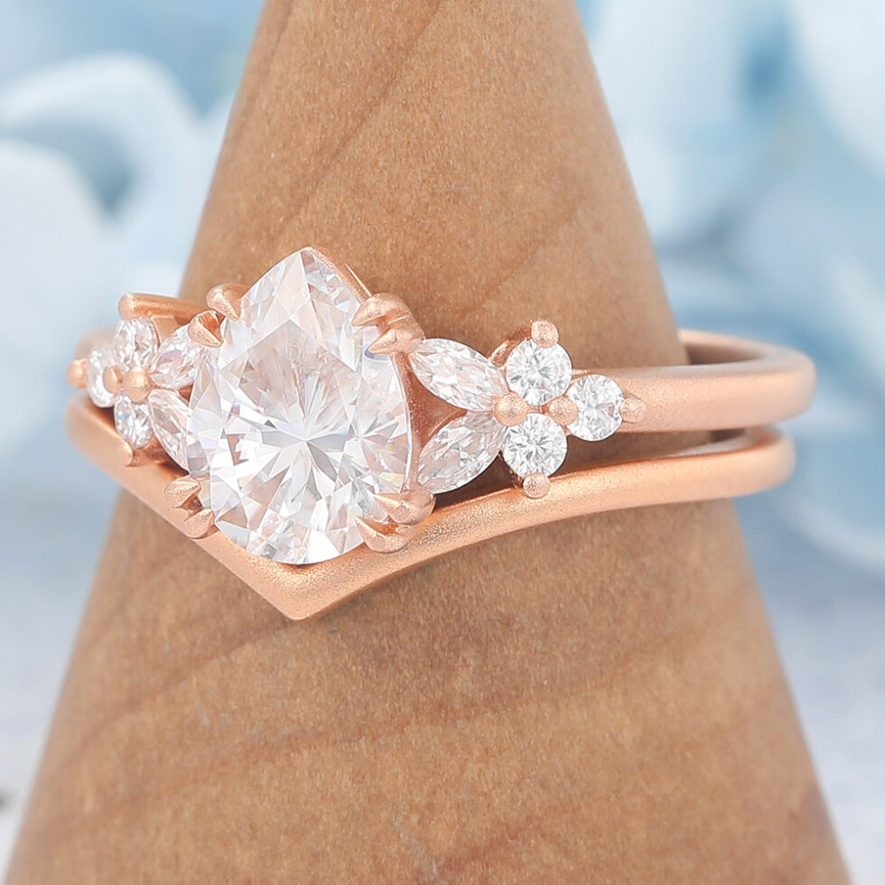Matte Finish Pear Cut Moissanite Engagement Ring Set with Floral Accent
