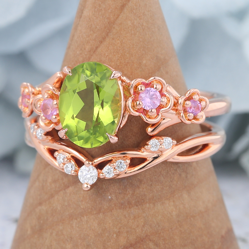 Rose Gold Oval Cut Peridot Nature-Inspired Bridal Ring Set (3) Rose Gold Oval Cut Peridot Nature-Inspired Bridal Ring Set (3)