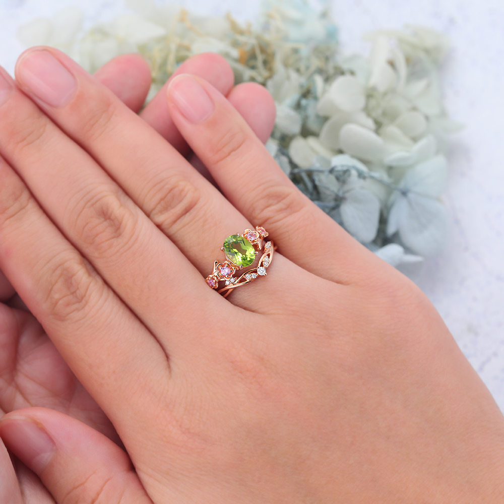 Rose Gold Oval Cut Peridot Nature-Inspired Bridal Ring Set (5) Rose Gold Oval Cut Peridot Nature-Inspired Bridal Ring Set (5)