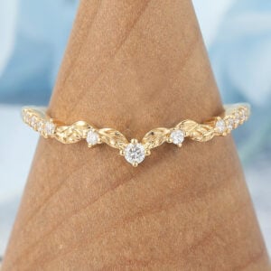 The leaf inspired stacking ring features small carat moissanite stones on the leaf shaped band, which is a unique stacking ring.
