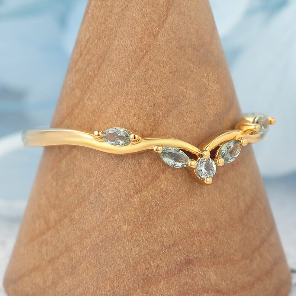 Natural-Inspired Curved Wedding Band with Green Sapphire Accents