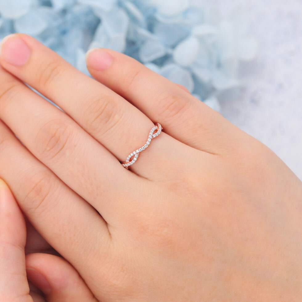 Infinity-Inspired Curved Wedding Band with Petite Moissanite